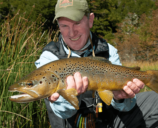 Pat Dorsey holding a brown trout